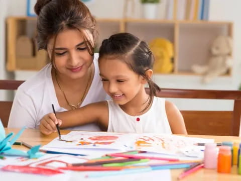 a person and a girl painting