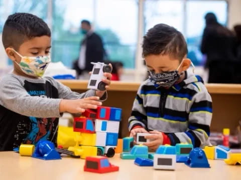 a couple of boys playing with toys