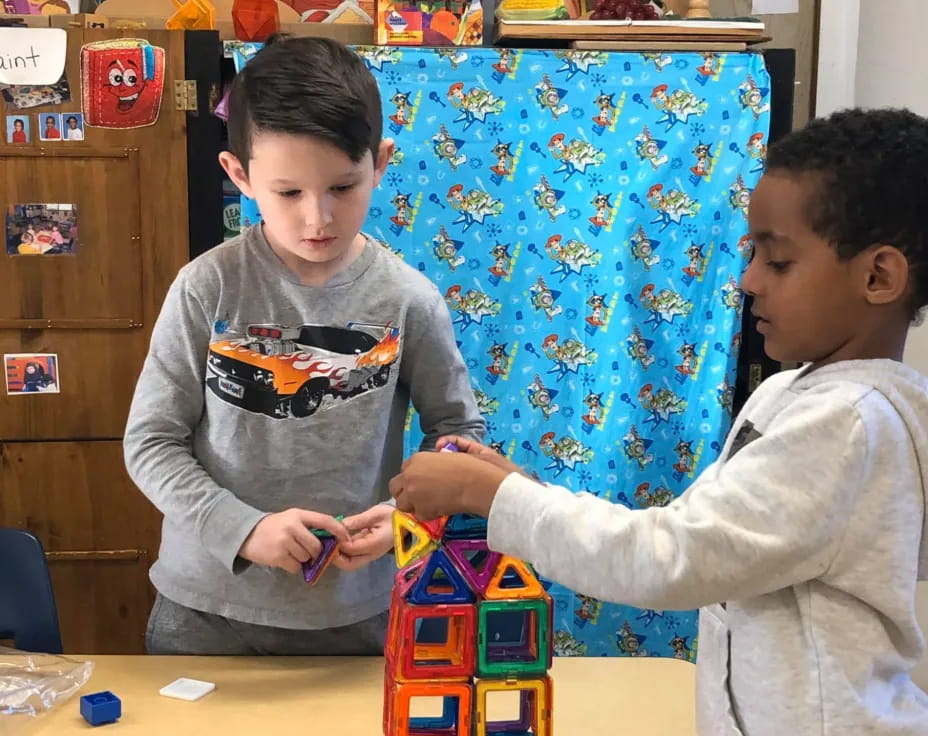 a couple of boys playing with toys
