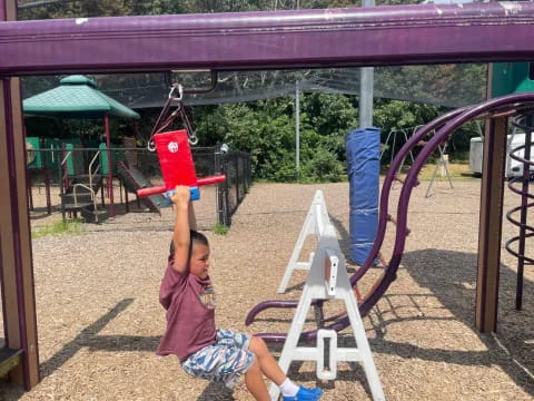 a child playing on a playground