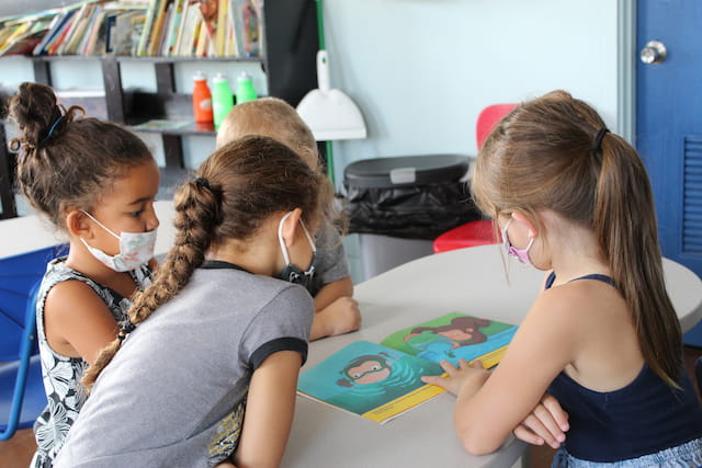 a few young girls painting