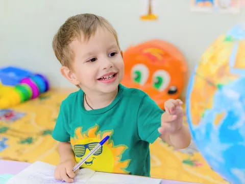 a baby holding a toothbrush