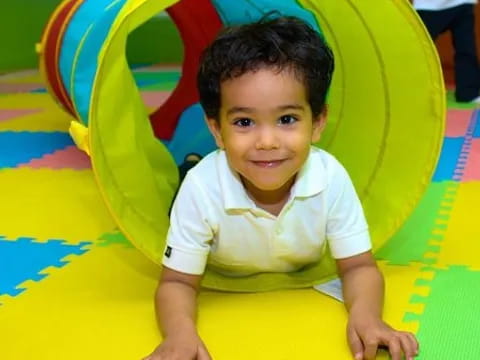 a child sitting in a ball