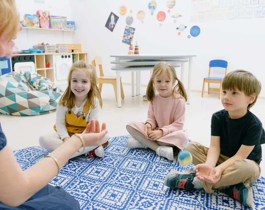 a group of children sitting on the floor