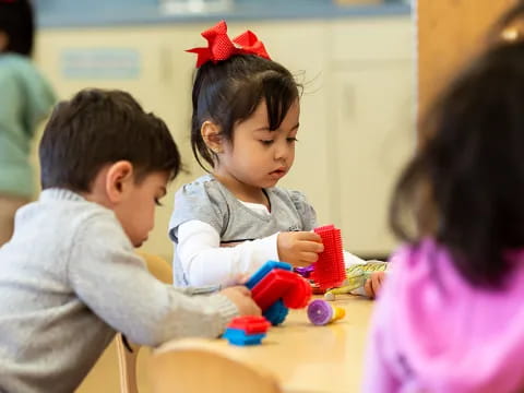 a few children playing with toys