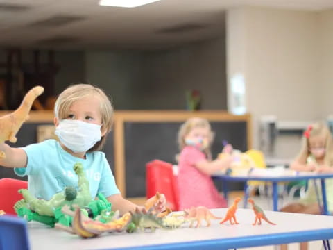 a group of children wearing masks