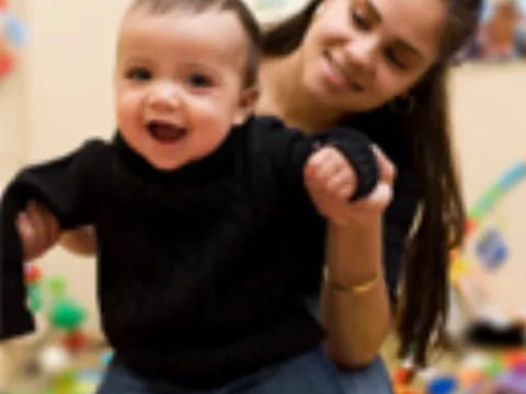 a person holding a baby