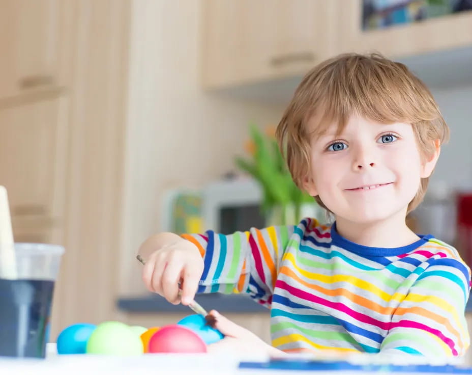 a child holding a spoon