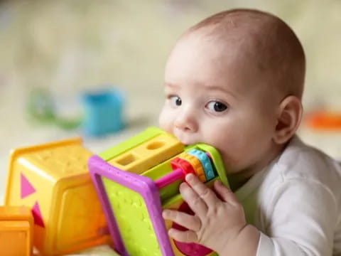 a baby playing with toys
