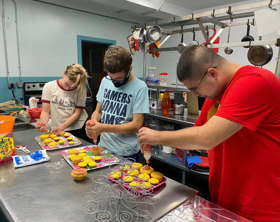 people preparing food in a kitchen