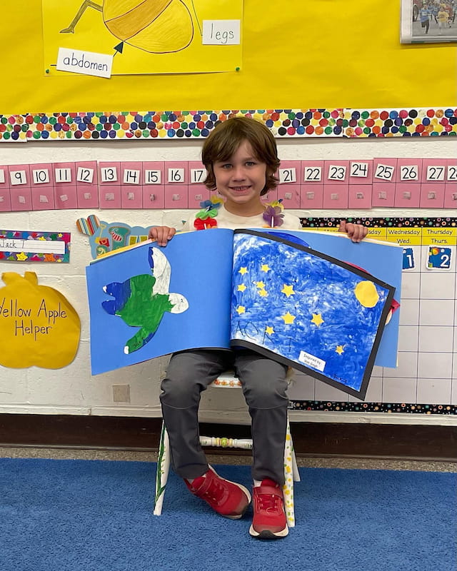 a boy holding a flag