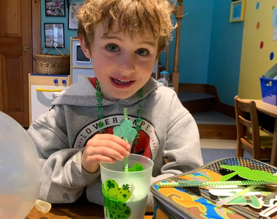 a boy sitting at a table