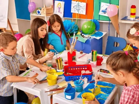 a group of children painting