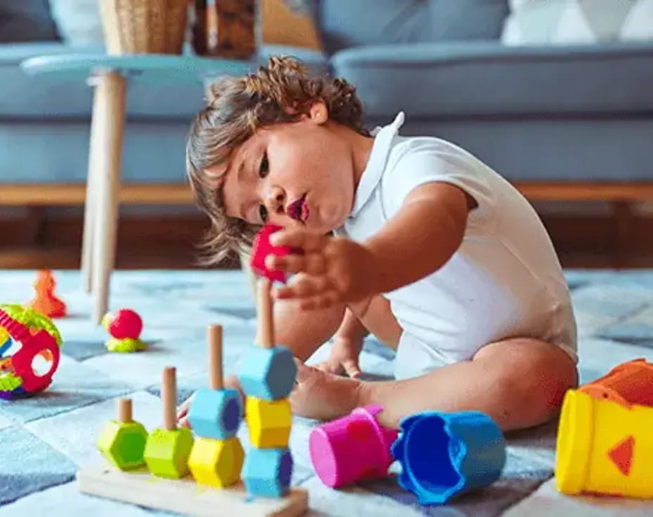 a baby playing with toys