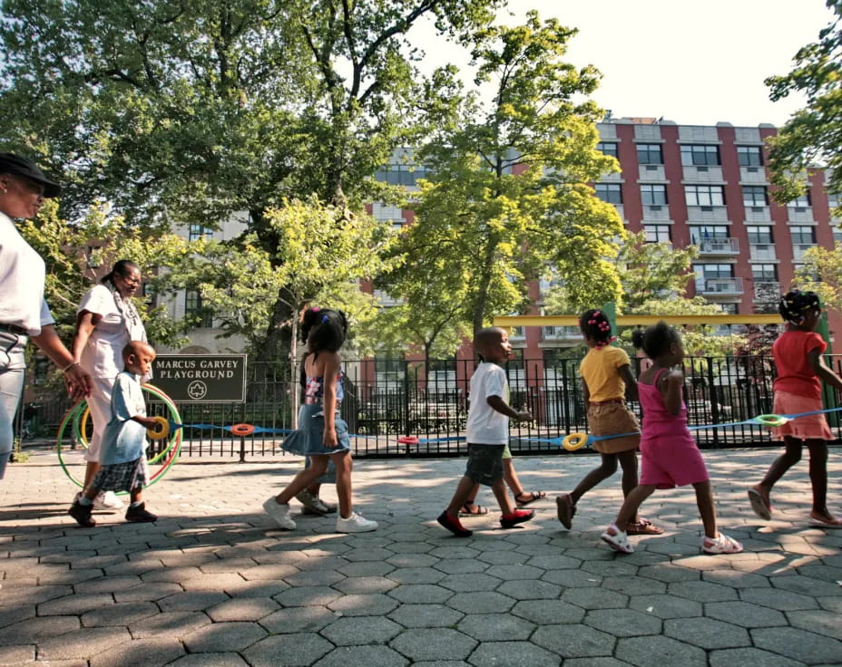 a group of people playing tennis