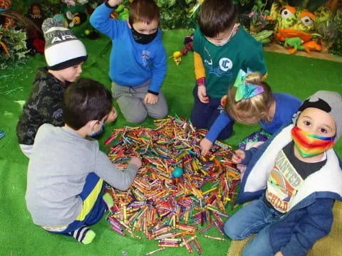 a group of children playing with a puzzle