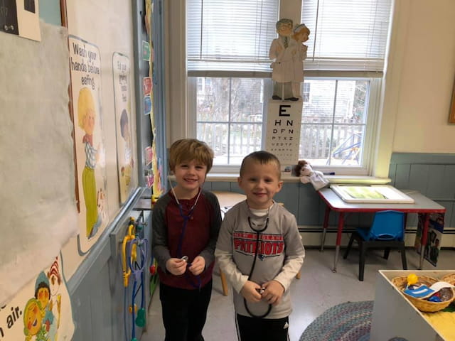 a couple of boys posing for the camera