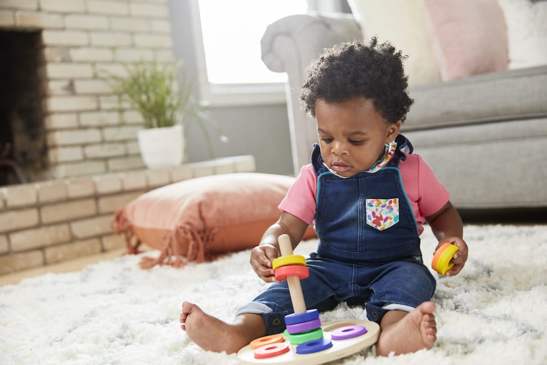 a baby playing with toys