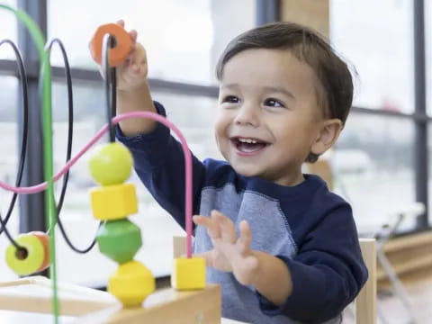 a child holding a toy
