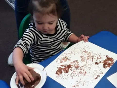 a girl sitting at a table