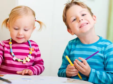 a couple of young girls painting