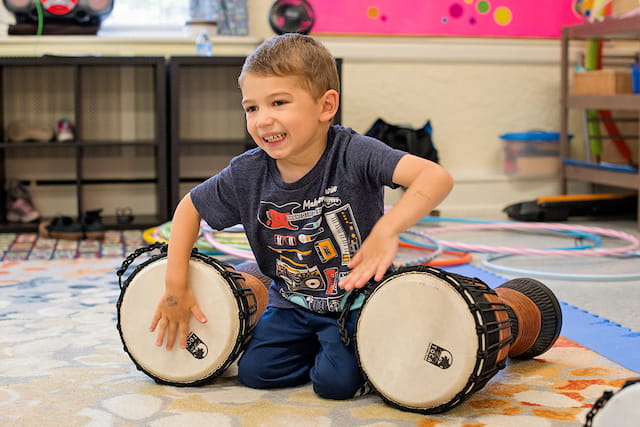 a boy playing drums