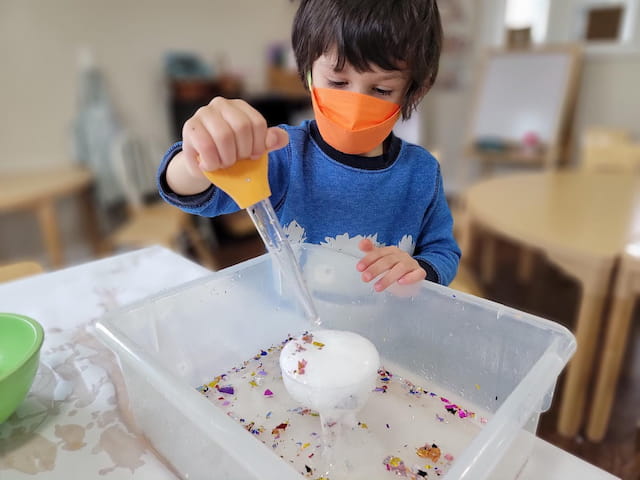a kid eating a cake