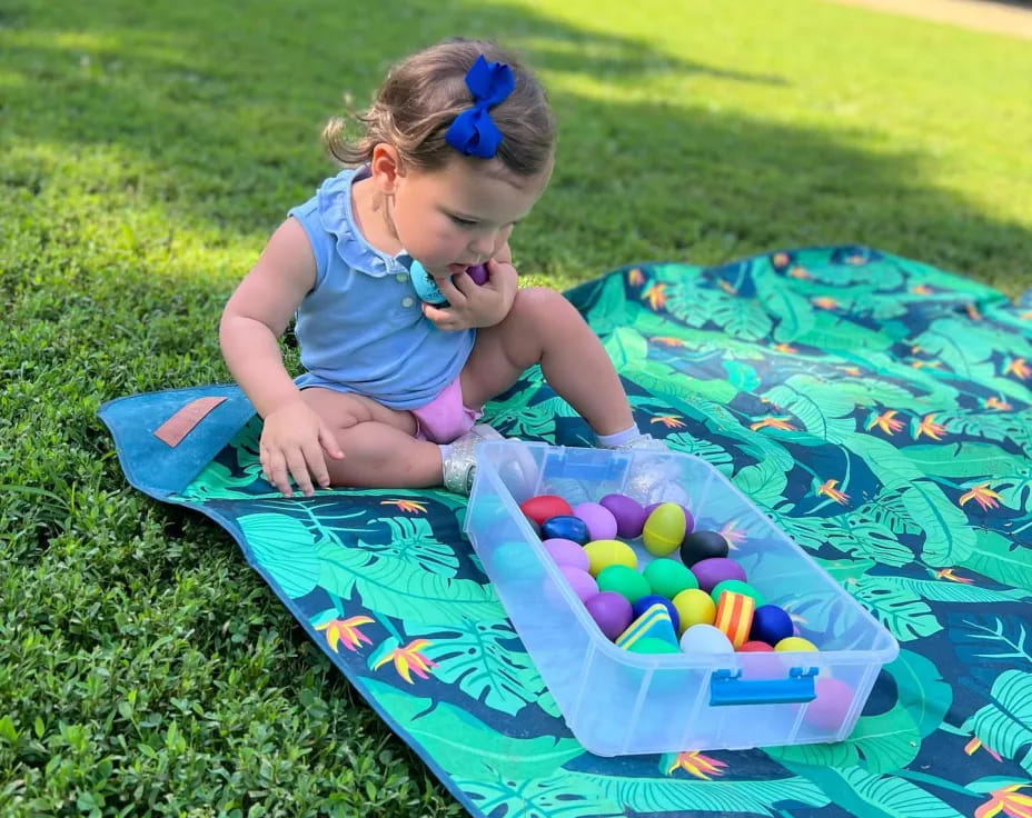 a girl playing with a ball