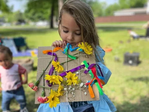 a girl holding flowers