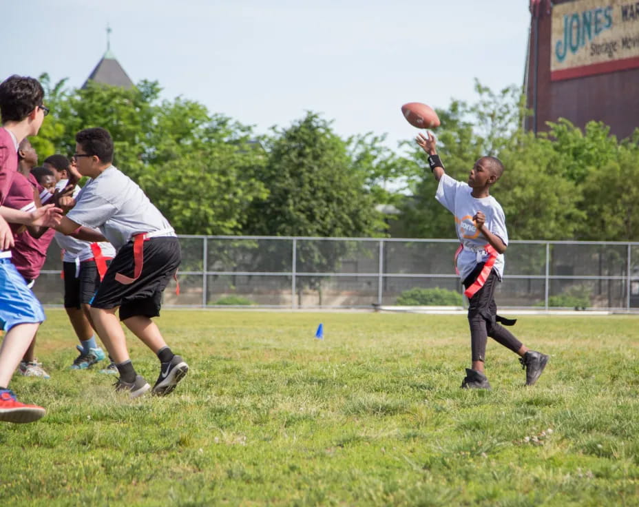 a group of people playing football