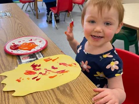 a child sitting at a table