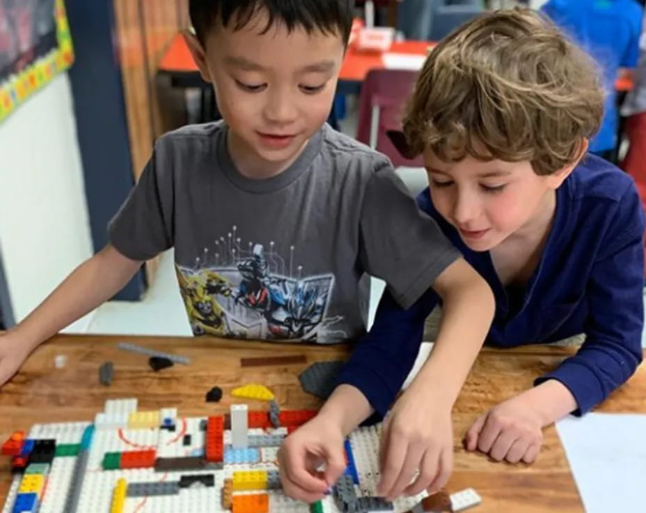 a couple of boys playing with toys