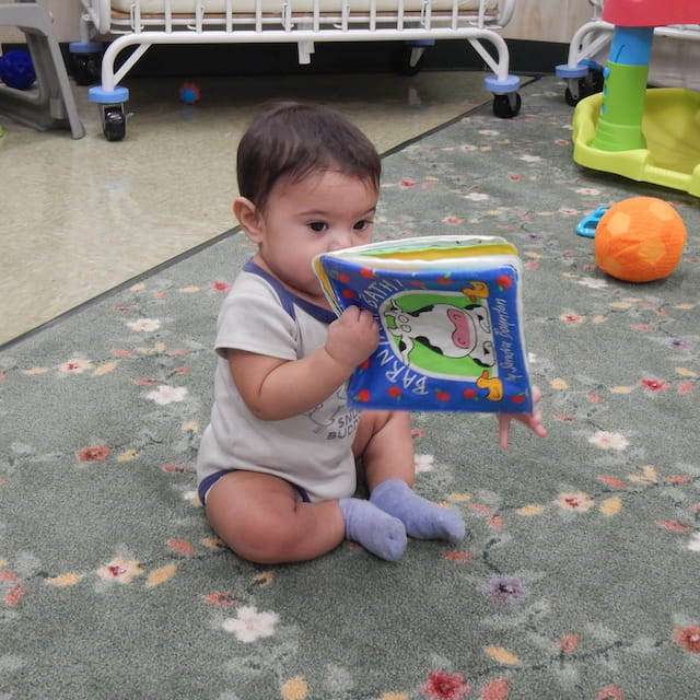 a baby playing with a toy
