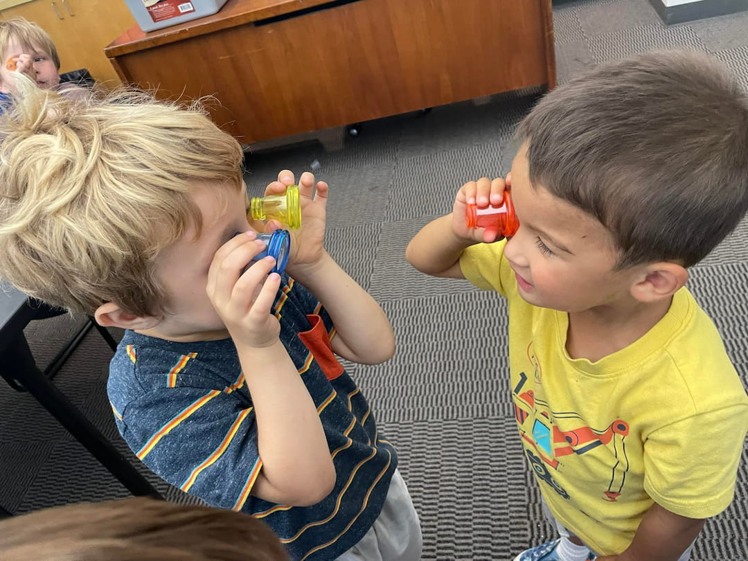 a couple of kids playing with toys