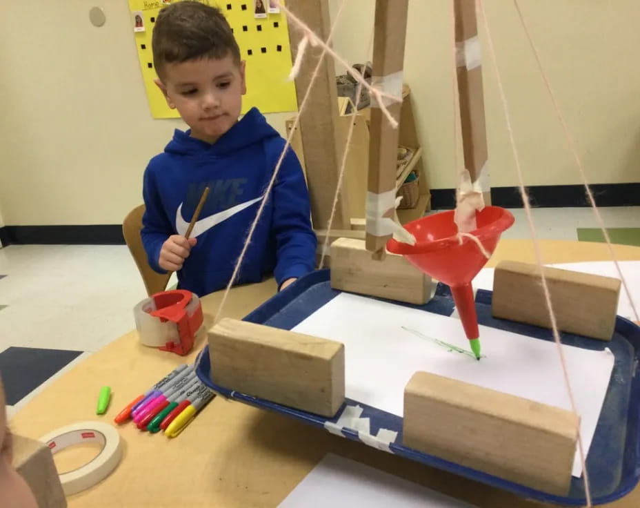 a child painting on a table