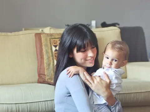a person holding a baby