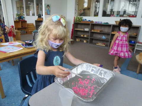 a young girl wearing a mask