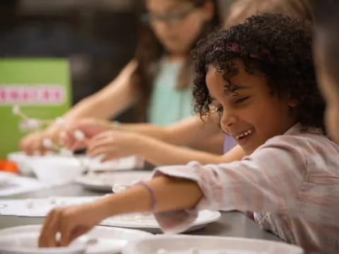 a young girl smiling
