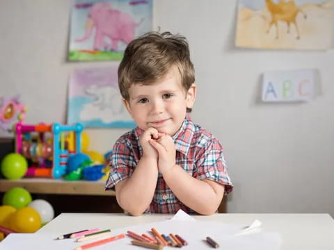 a boy sitting at a table