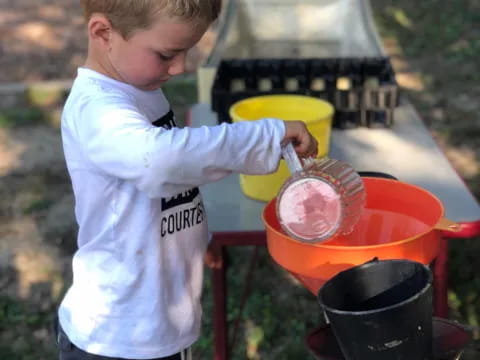 a young boy using a tool