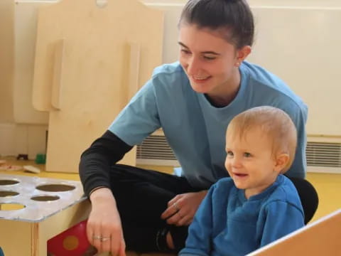 a person holding a baby