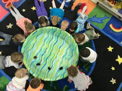 a group of children around a globe
