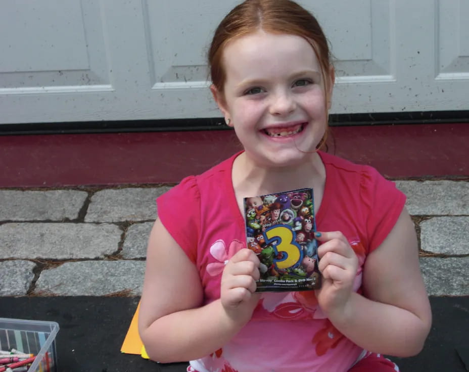 a girl holding a book