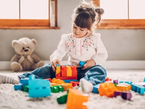 a baby playing with toys
