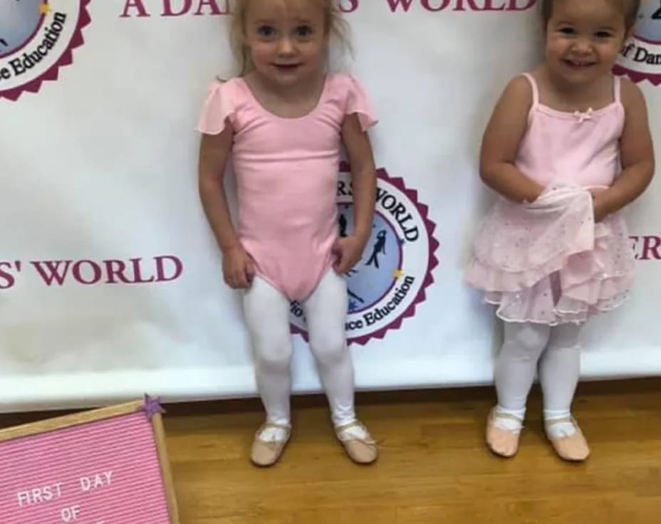 two girls in dresses