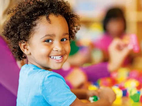 a young girl smiling