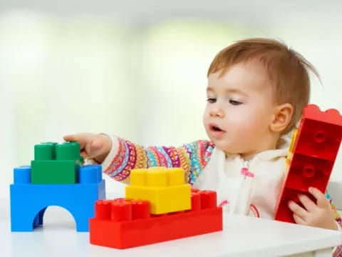 a baby playing with toys