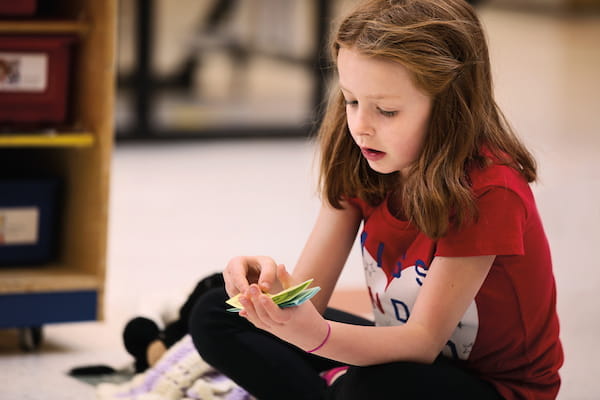 a girl sitting on the floor