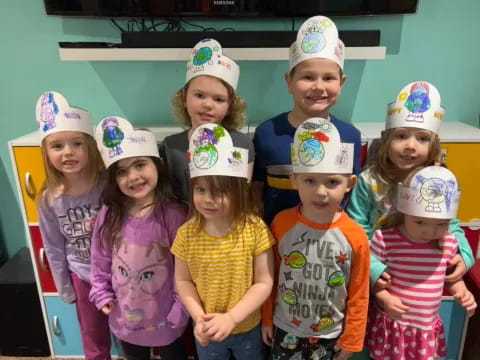 a group of children wearing hats