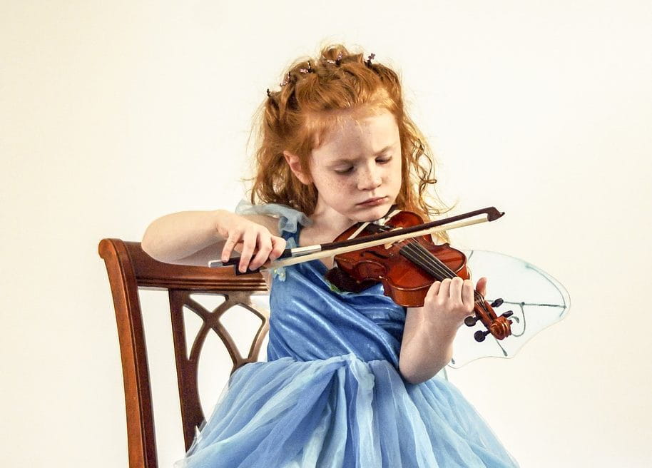 a girl playing a violin